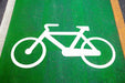 98:2 Green Bike Lane MMA Paint with picture of white bike against green MMA paint