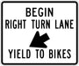 r4-4 white and black BEGIN RIGHT TURN LANE YIELD TO BIKES High Intensity Prismatic (HIP) Sign | 36" x 30"