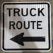 White and Black Truck Route Sign with black left arrow R14-1