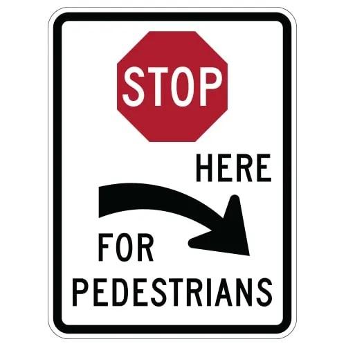 R1-5C STOP HERE FOR PEDESTRIANS SIGN in white, red and black.