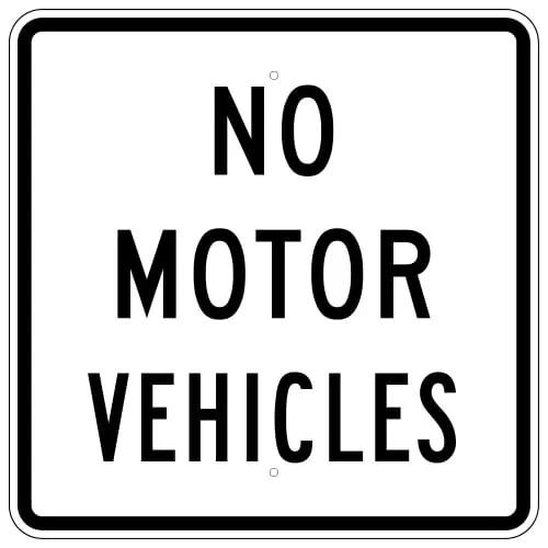 white sign with NO MOTOR VEHICLES in black with black border