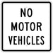 white sign with NO MOTOR VEHICLES in black with black border