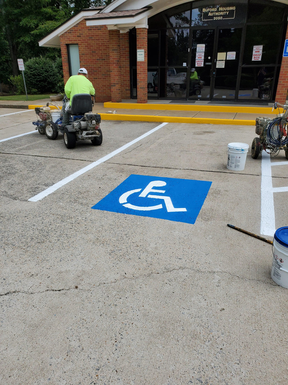 Blue handicap stencil in parking lot | Traffic Depot
